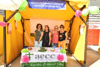 La AECC local participa con una caseta en el estreno del Festival Solidario de Música, Voluntariado y Cooperación  Colmenar Viej